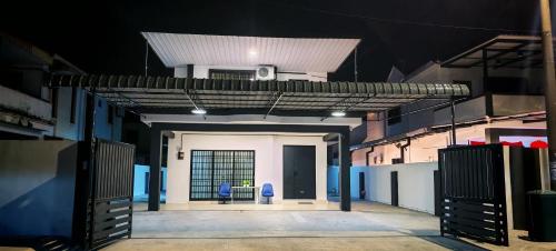 a view of a room with two chairs in a building at 23 Inn Singlebed Share Bathroom No Window in Bukit Mertajam