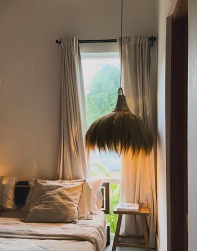 a bed in a room with a large window at CASA ROSA 49’ - Playa Venao Beach in Playa Venao