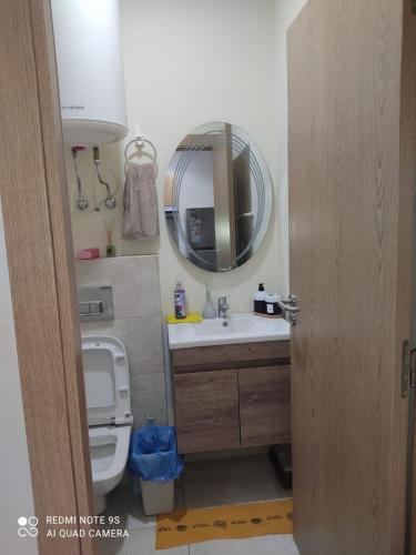 a bathroom with a sink and a mirror at Ocean Park Zenata City Eco in Casablanca