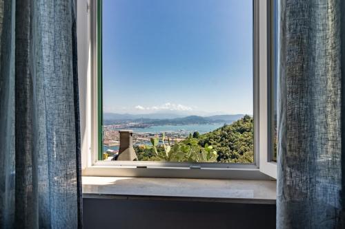 an open window with a view of the city at Golden View Holidays in La Spezia