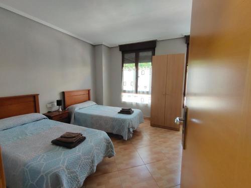 Postel nebo postele na pokoji v ubytování Hostal Abastos