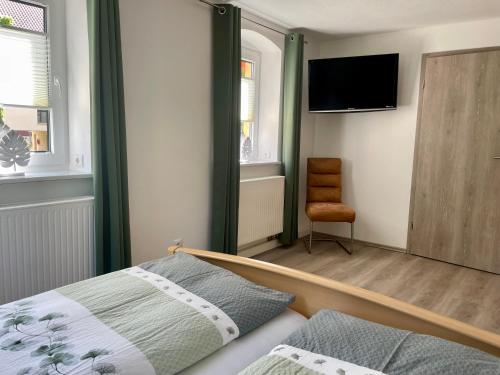 Postel nebo postele na pokoji v ubytování Ferienwohnung "Am Kirchsteig"