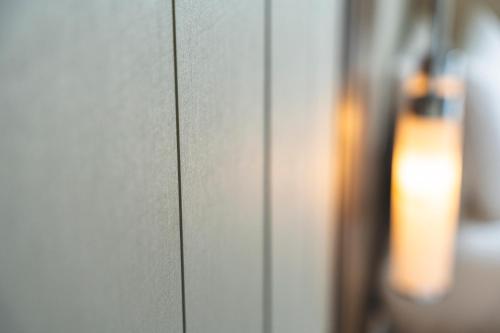 a close up of a wall with a light on it at Rihga Royal Gran Okinawa in Naha