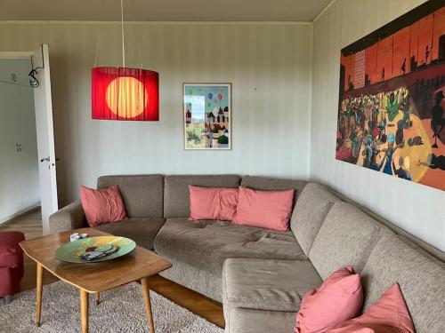 a living room with a couch and a table at Krokens Gård in Fotskäl