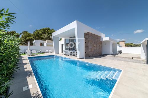 Villa Coral, chic coastal design, saltwater pool - by OYOOSTAYS