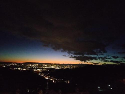 a view of a city at night at Casa Angy in Adrara San Rocco