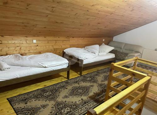 Postel nebo postele na pokoji v ubytování Vila Ponijeri