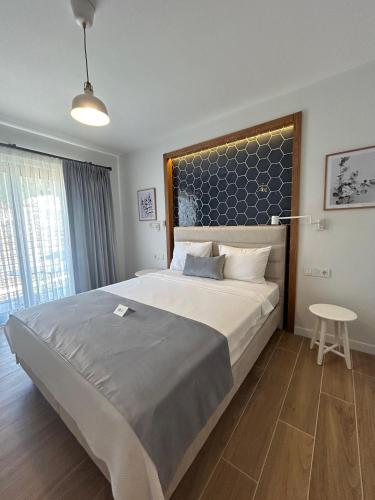 Кровать или кровати в номере Olea Nova Hotel