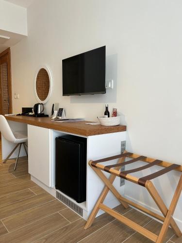 Телевизор и/или развлекательный центр в Olea Nova Hotel