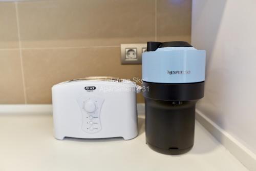 a toaster and a toaster sitting on a counter at INTEMPO SKY Apartament-231 in Benidorm