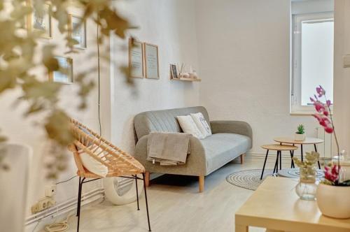 a living room with a couch and a chair at Patio de Calderería by Clabao in Pamplona