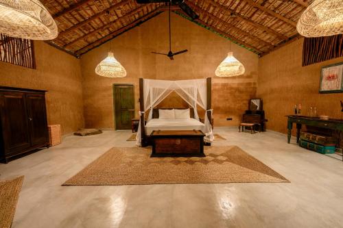 a bedroom with a bed in the middle of a room at Yakaduru - Yala in Yala