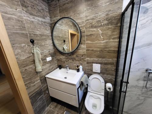 a bathroom with a sink and a mirror at Herzegovina Dream Residence in Stolac