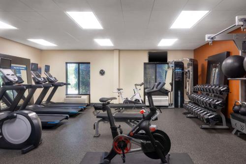 a gym with several treadmills and cardio machines at Hampton Inn & Suites Birmingham/280 East-Eagle Point in Hoover