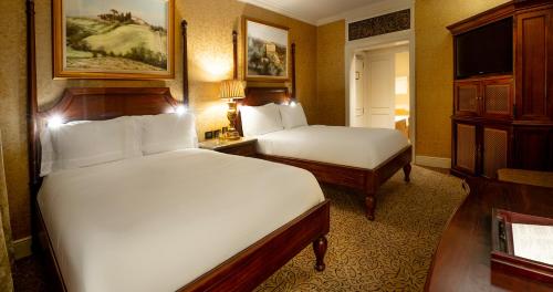 Un ou plusieurs lits dans un hébergement de l'établissement Palazzo Hotel