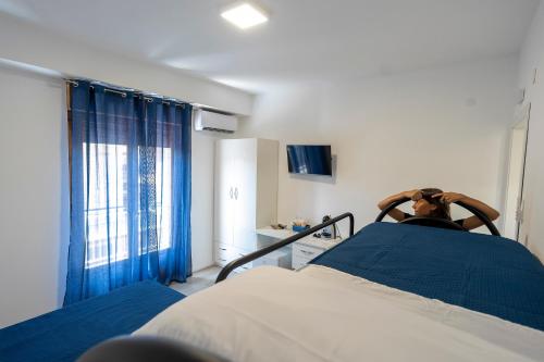 a hospital room with a bed and a window at Prestige House 8 in Scalea