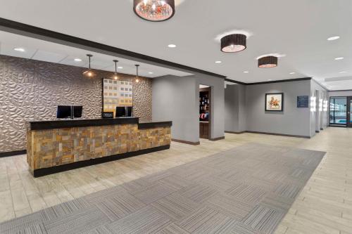a lobby with a reception desk in a building at Hampton Inn & Suites Columbus Scioto Downs in Columbus