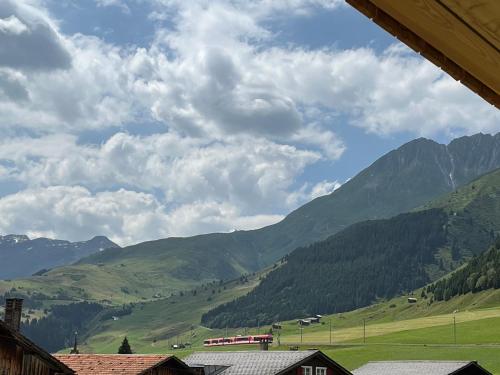 a view of a valley with mountains in the background at Casa Molina in Sedrun