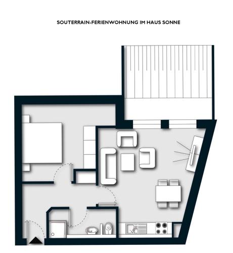 a black and white floor plan of a house at Apartmenthaus Haus Sonne I direkt am Strand in Dierhagen