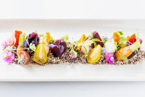 a plate of food with vegetables and fruit on top at PARKROYAL Darling Harbour, Sydney in Sydney