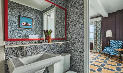 a bathroom with a sink and a mirror at Graduate by Hilton Providence in Providence
