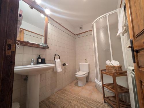 a bathroom with a sink and a toilet at Fonda dels Pics in Escardacs