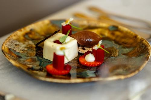 a plate of food with desserts on a table at Hotel Jaufentalerhof in Racines