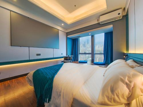 Ένα ή περισσότερα κρεβάτια σε δωμάτιο στο STAR STAGE International Apartment Hotel - 1min to Line2 & Line8 ChangGang STN-Free private car delivery to Canton Fair from Otc 15th to Nov 4th