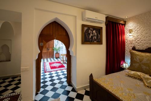 Ein Bett oder Betten in einem Zimmer der Unterkunft Riad Lella Chama