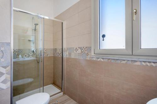 a bathroom with a shower and a toilet and a sink at Casa Alle Porte Della Costiera in Cava deʼ Tirreni