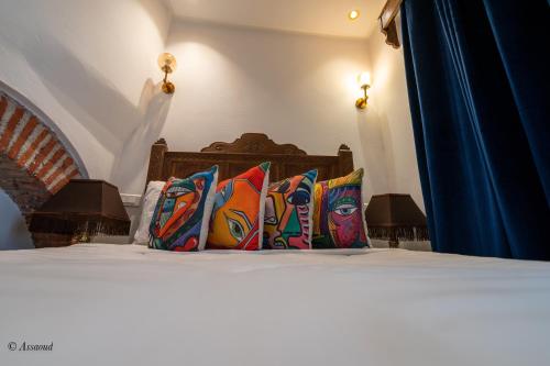 Ein Bett oder Betten in einem Zimmer der Unterkunft Riad Lella Chama