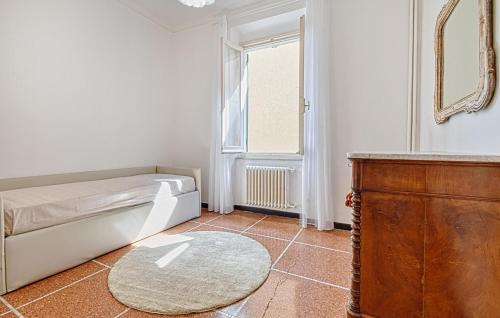 a bedroom with a bed and a window and a rug at Lovely Apartment In Sestri Levante in Sestri Levante