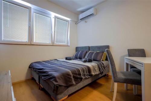 Säng eller sängar i ett rum på Fenix Flat