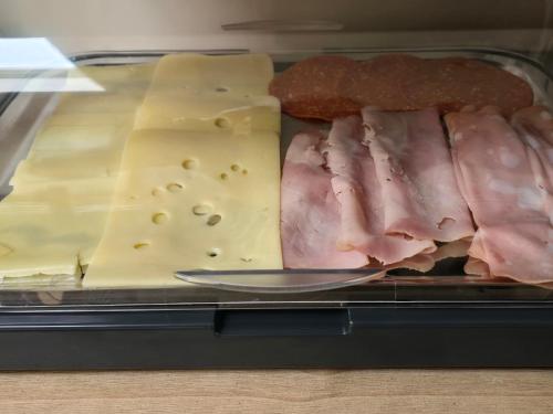 a tray of different types of meats and cheese at Chilton Villa B&B in Sandwich