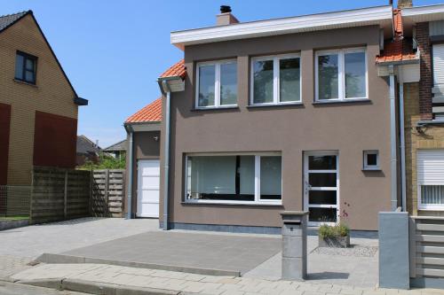 a house with a driveway in front of it at Casa K in Middelkerke