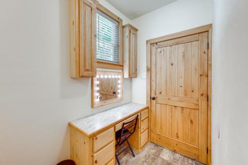 a home office with a wooden door and a window at Quitman Lakefront Cabin with Screened Porch and Grill! in Quitman