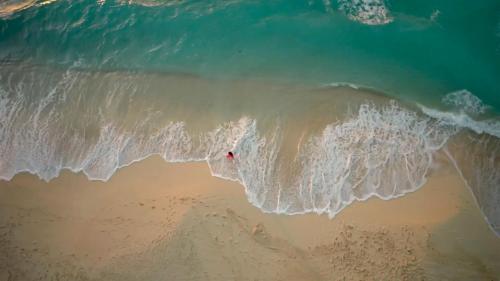 an overhead view of the ocean with a wave at Gewan Palace New Alamein in El Alamein