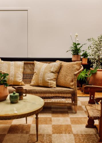 a living room with a couch and a table at Locke de Santa Joana in Lisbon