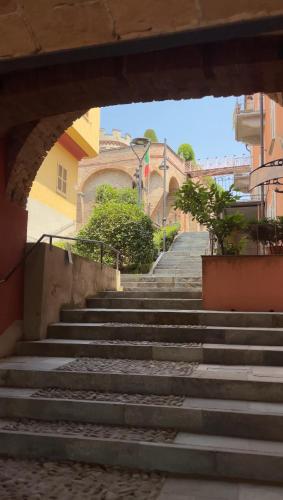 a set of stairs leading up to a building at Vicolo Al Castello - Langhe e Monferrato Suites in Costigliole dʼAsti