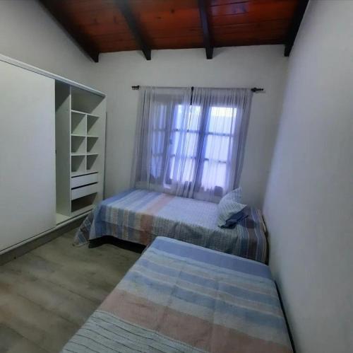 Postel nebo postele na pokoji v ubytování Casa 1136 FIRMAT