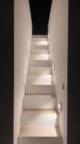 a staircase in a house with lights on it at CAMPO SUITES in Kampos Paros