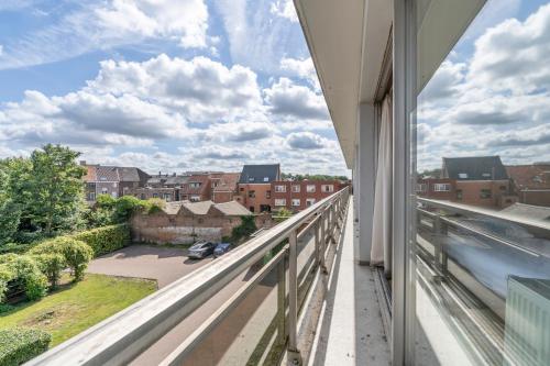 a balcony with a view of a city at Value Stay Residence Mechelen in Mechelen