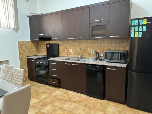 Η κουζίνα ή μικρή κουζίνα στο Savannah Pinoy Hostel