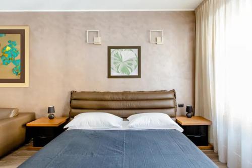 Кровать или кровати в номере Hotel Vitruvio