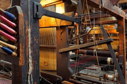 a wooden machine with a bunch of ropes at Beautiful & unique riverside town centre apartment in Macclesfield