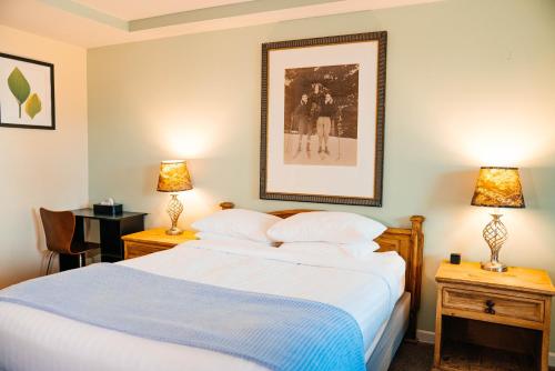 Ένα ή περισσότερα κρεβάτια σε δωμάτιο στο Salida Inn & Monarch Suites