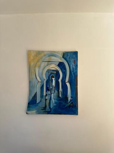 a painting hanging on a wall at Dar Faracha Fes in Fès