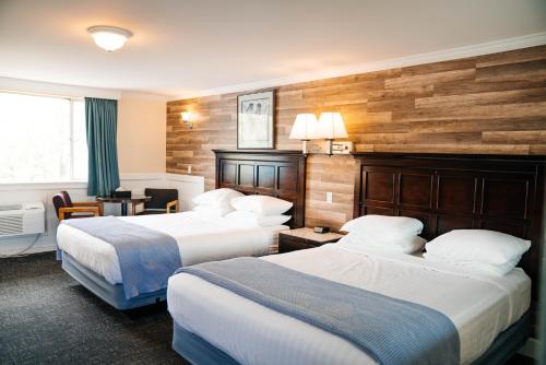 Ένα ή περισσότερα κρεβάτια σε δωμάτιο στο Salida Inn & Monarch Suites