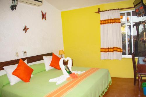 Ένα ή περισσότερα κρεβάτια σε δωμάτιο στο Hotel La Cabaña