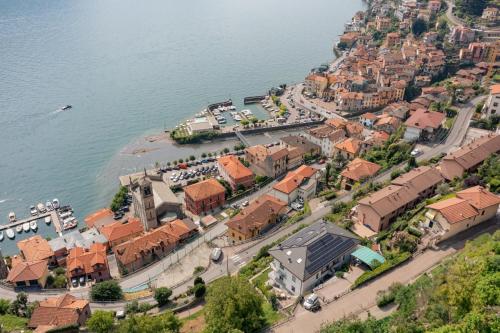 an aerial view of a town next to the water at Argegno Como Lake in Argegno